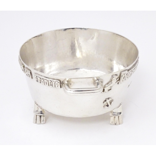 420 - A silver Arts and Crafts style bowl modelled as The Winchester Bushel, with hammered decoration, app... 