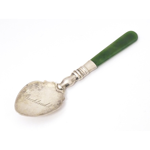 429 - A silver souvenir spoon with a New Zealand jade nephrite handle, the bowl engraved Auckland N. Z. Ha... 