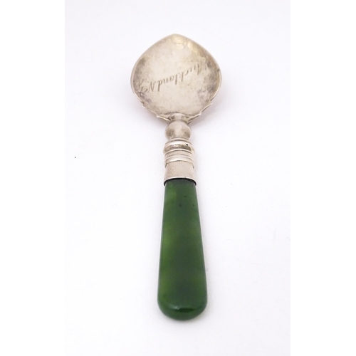 429 - A silver souvenir spoon with a New Zealand jade nephrite handle, the bowl engraved Auckland N. Z. Ha... 