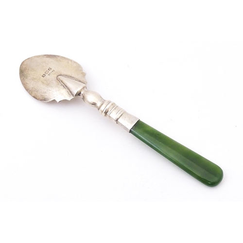 429 - A silver souvenir spoon with a New Zealand jade nephrite handle, the bowl engraved Auckland N. Z. Ha... 