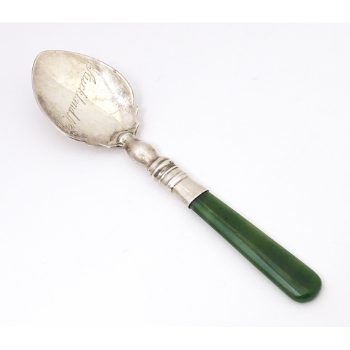 429 - A silver souvenir spoon with a New Zealand jade nephrite handle, the bowl engraved Auckland N. Z. Ha... 