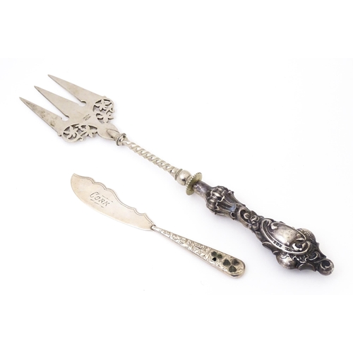 430 - A silver handled bread fork, hallmarked Birmingham 1901, maker E. S. Barnsley & Co. Together with a ... 