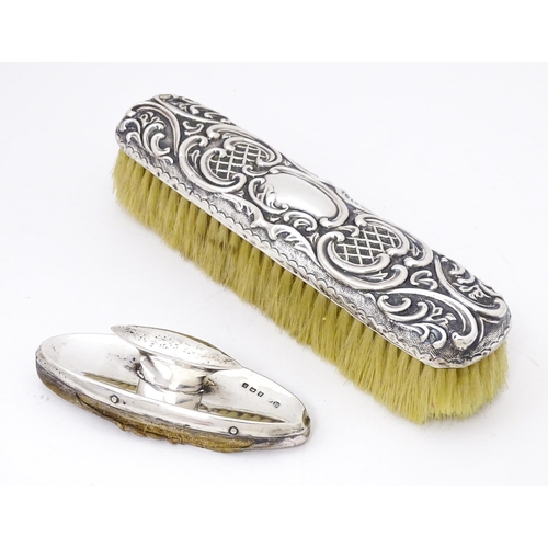 432 - A silver handled brush with embossed decoration, hallmarked Birmingham 1899, maker Thomas Hayes. Tog... 