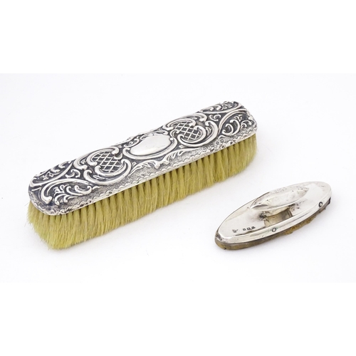 432 - A silver handled brush with embossed decoration, hallmarked Birmingham 1899, maker Thomas Hayes. Tog... 