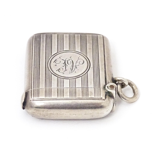 436 - A silver vesta case with engine turned decoration, hallmarked Chester 1904, maker William Neale & So... 