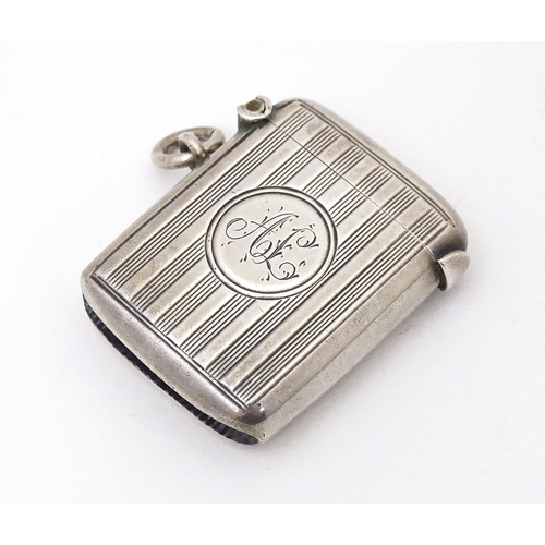 436 - A silver vesta case with engine turned decoration, hallmarked Chester 1904, maker William Neale & So... 