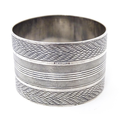 441 - Five assorted silver napkin rings to include two hallmarked Birmingham 1960,  one marked Sterling, o... 