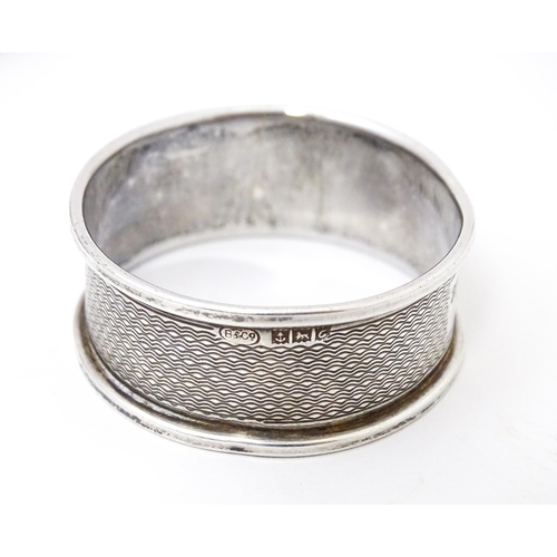 441 - Five assorted silver napkin rings to include two hallmarked Birmingham 1960,  one marked Sterling, o... 