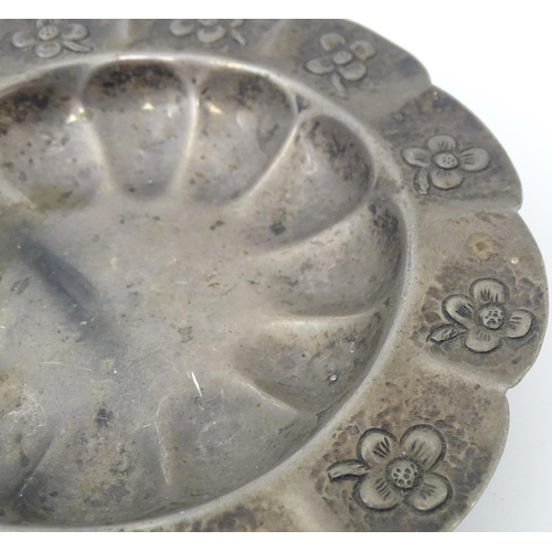 450 - A Mexican silver dish with floral detail and raised on three ball and claw feet. Marked under Mexico... 