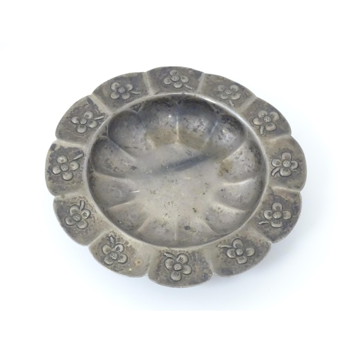 450 - A Mexican silver dish with floral detail and raised on three ball and claw feet. Marked under Mexico... 