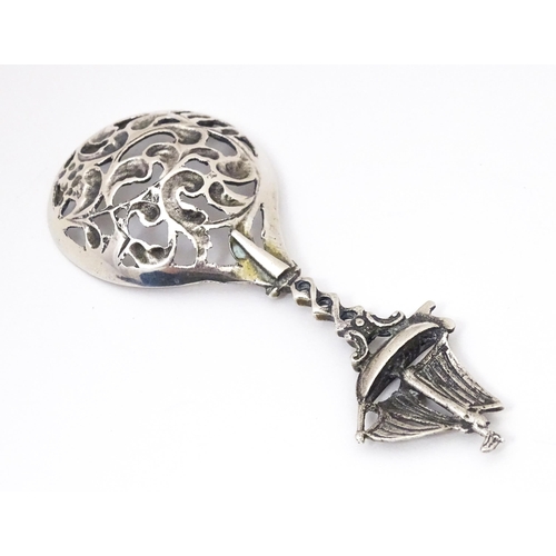 456 - A Continental .833 silver spoon with pierced decoration to bowl and sailing boat to handle. Indistin... 