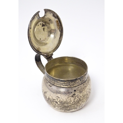 459 - An Irish silver mustard pot hallmarked Dublin 1916 maker Wakely & Wheeler. Approx 2 1/2