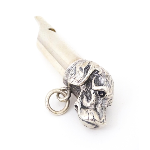 460 - A silver plate whistle with dog head decoration. 3