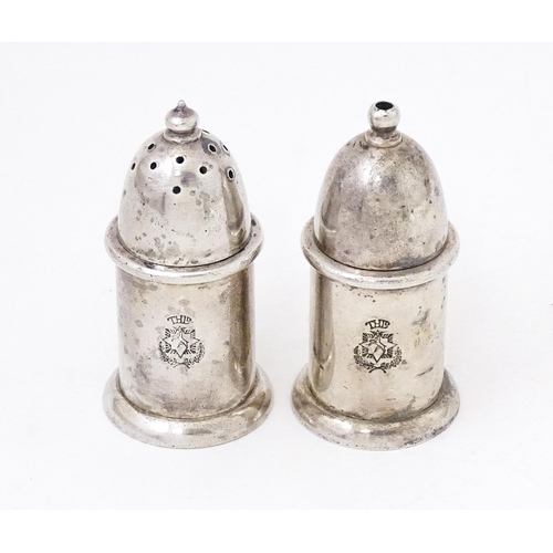 463 - A pair of silver plate pepperettes stamped under Mappin & Webb. 2 3/4