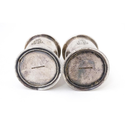 463 - A pair of silver plate pepperettes stamped under Mappin & Webb. 2 3/4