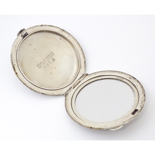 475 - A Silver compact with engine turned decoration. Hallmarked Birmingham 1965 maker Garrard & Co Ltd. A... 