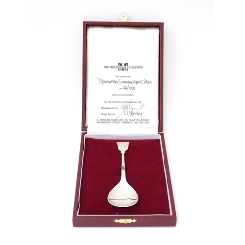 485 - A silver limited edition Millennium commemorative spoon. Hallmarked Birmingham 2000 maker A Edward J... 