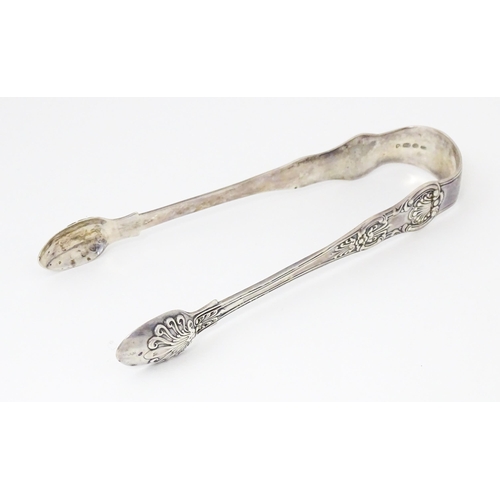 486 - Silver tongs hallmarked London 1843 maker Charles Boyton. Approx 6