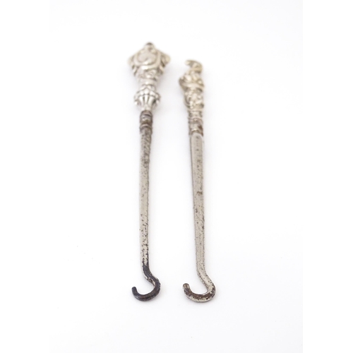 492 - Two silver handled button hooks. One hallmarked Birmingham 1901 maker William Devenport. Approx 6 1/... 