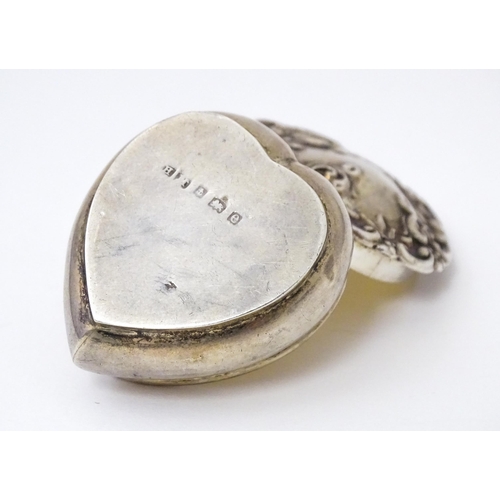 496 - A silver pot of heart form with hinged lid and gilded interior. Hallmarked Birmingham 1904 maker Hen... 