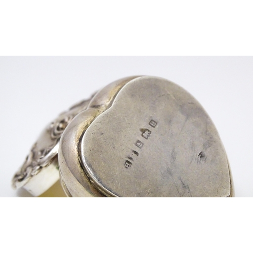 496 - A silver pot of heart form with hinged lid and gilded interior. Hallmarked Birmingham 1904 maker Hen... 