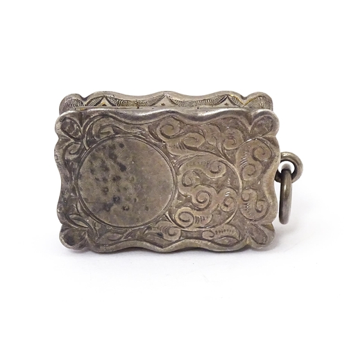 501 - A Victorian silver vinaigrette, the hinged lid opening to reveal hinged grill and gilded interior, h... 