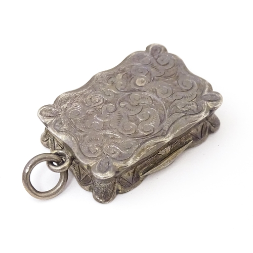 501 - A Victorian silver vinaigrette, the hinged lid opening to reveal hinged grill and gilded interior, h... 