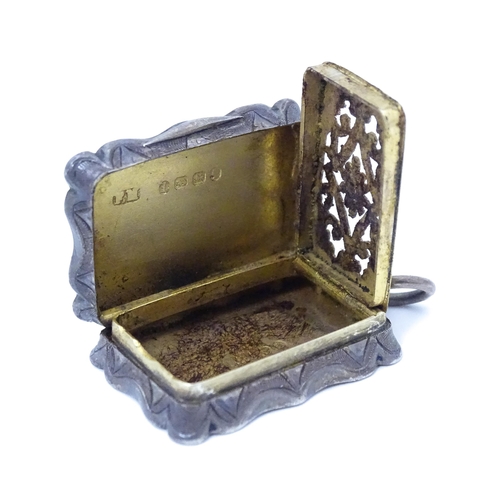 501 - A Victorian silver vinaigrette, the hinged lid opening to reveal hinged grill and gilded interior, h... 