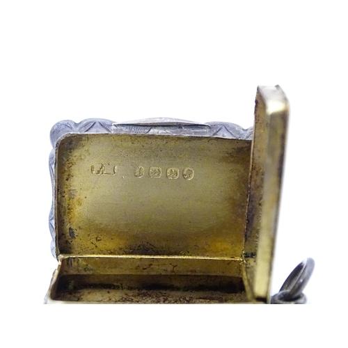 501 - A Victorian silver vinaigrette, the hinged lid opening to reveal hinged grill and gilded interior, h... 