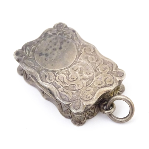 501 - A Victorian silver vinaigrette, the hinged lid opening to reveal hinged grill and gilded interior, h... 