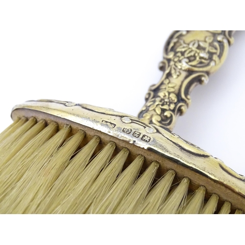 503 - A silver gilt handled hat brush hallmarked Birmingham 1899 maker Levi & Salaman. Approx 7