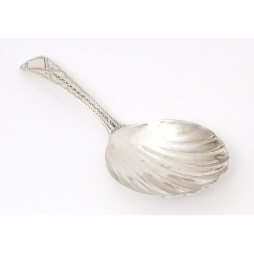 507 - A Geo III silver caddy spoon with shell formed bowl, hallmarked London 1802 maker George Wintle. App... 