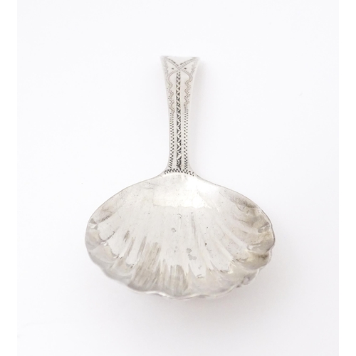 507 - A Geo III silver caddy spoon with shell formed bowl, hallmarked London 1802 maker George Wintle. App... 