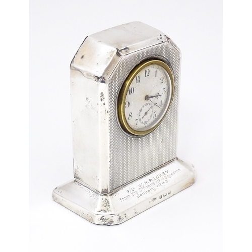 560 - WWII RAF interest : A silver cased mantle clock with engine turned decoration and inscription to ' F... 