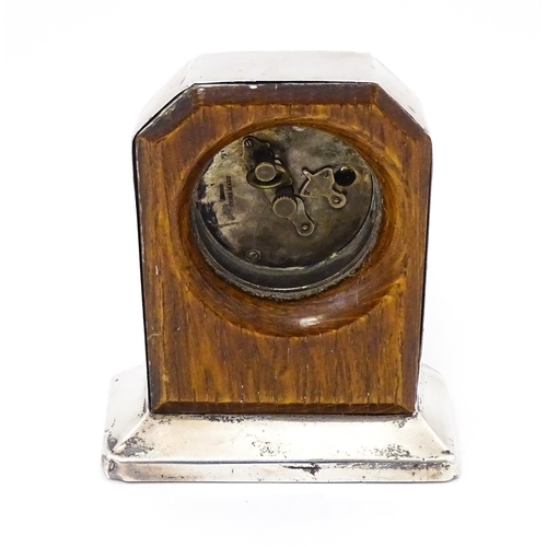 560 - WWII RAF interest : A silver cased mantle clock with engine turned decoration and inscription to ' F... 