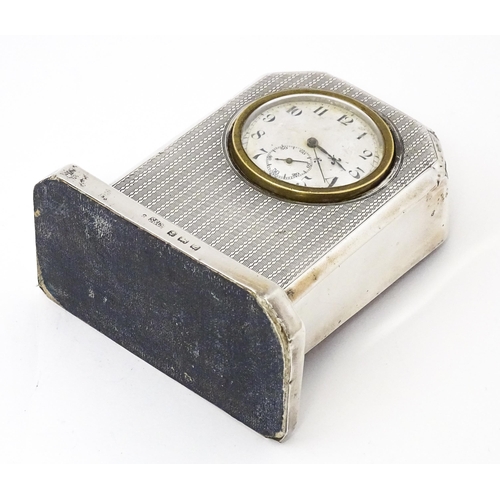 560 - WWII RAF interest : A silver cased mantle clock with engine turned decoration and inscription to ' F... 