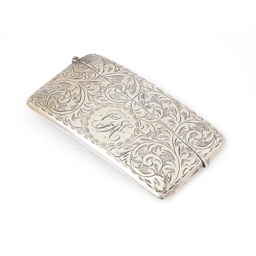 568 - A silver card case with engraved acanthus  scroll decoration. Hallmarked Birmingham 1920 maker Sydne... 