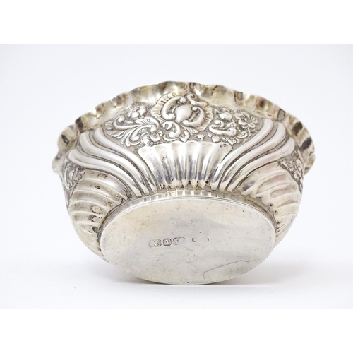 574 - A silver salt with embossed decoration hallmarked Birmingham 1893 maker henry Matthews 2 1/2