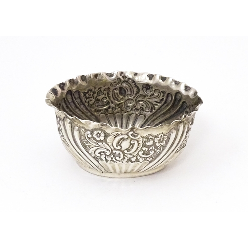 574 - A silver salt with embossed decoration hallmarked Birmingham 1893 maker henry Matthews 2 1/2