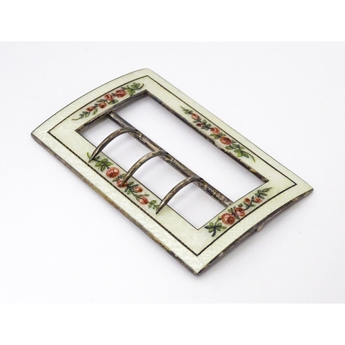 575 - A silver buckle with white guilloche enamel decoration and floral detail. Hallmarked Birmingham 1912... 