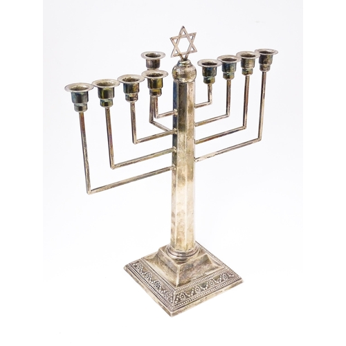 580 - Judaica : A silver Hanukkah Menorah with 9 branches and surmounted by Star of David. Hallmarked Lond... 