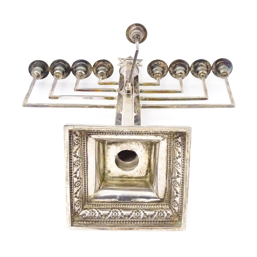 580 - Judaica : A silver Hanukkah Menorah with 9 branches and surmounted by Star of David. Hallmarked Lond... 