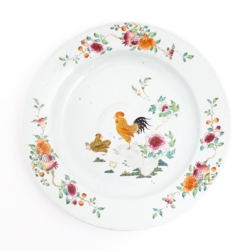 36 - A Chinese famille rose plate decorated with cockerel / rooster, hen and chicks, with peony flowers a... 