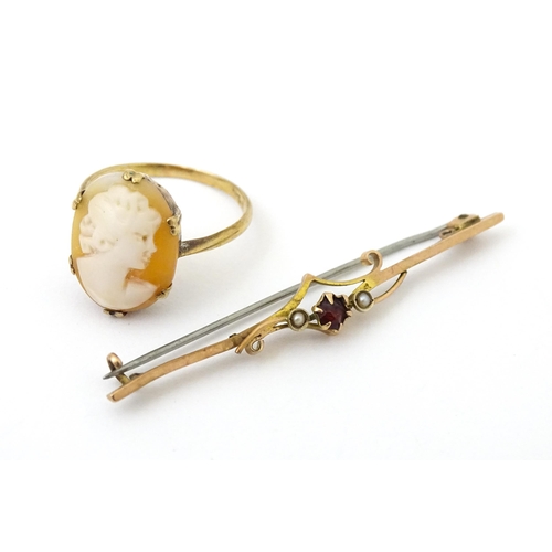 691 - A 9ct gold ring set with shell carved cameo. Together with a 9ct gold bar brooch. The brooch approx ... 