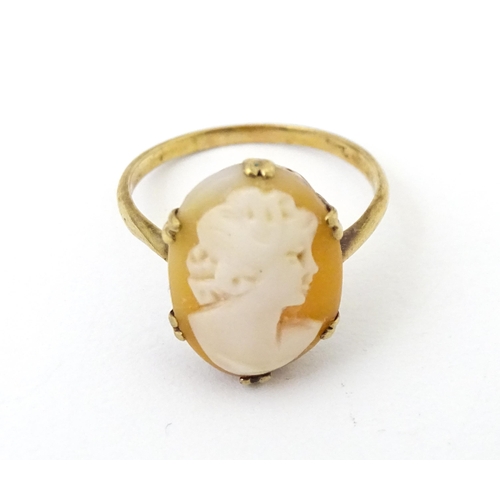 691 - A 9ct gold ring set with shell carved cameo. Together with a 9ct gold bar brooch. The brooch approx ... 