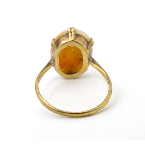 691 - A 9ct gold ring set with shell carved cameo. Together with a 9ct gold bar brooch. The brooch approx ... 