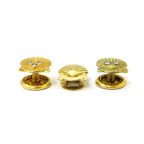 694 - Shell long service awards : A French gold stud / button of shell form by Cartier Paris. Marked verso... 