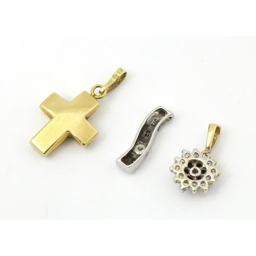 703 - Three various 9ct gold pendants to include a white gold example. Largest approx 3/4