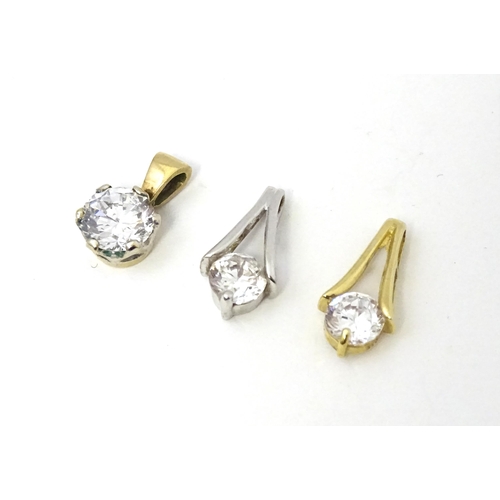 710 - Three 9ct gold pendants set with cubic zirconia. To include a white gold example. Approx 1/2