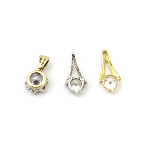 710 - Three 9ct gold pendants set with cubic zirconia. To include a white gold example. Approx 1/2